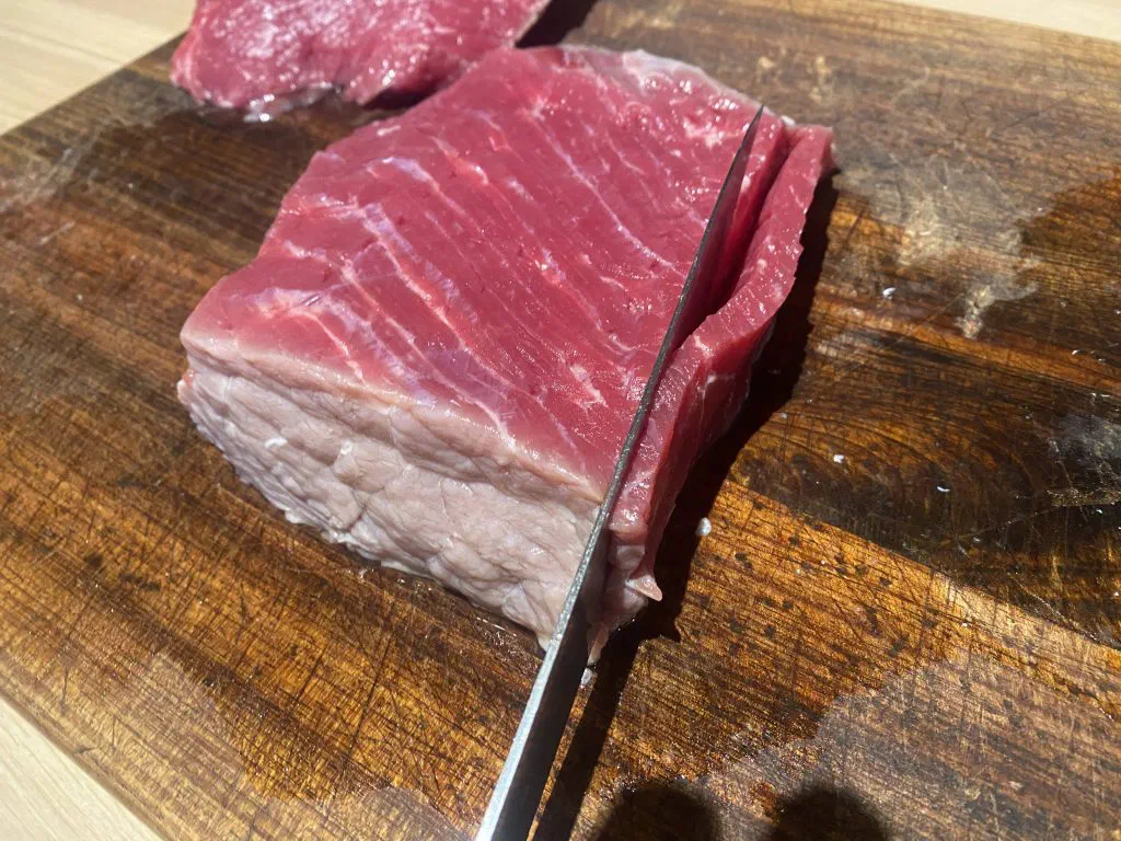 Slice the beef jerky against the grain